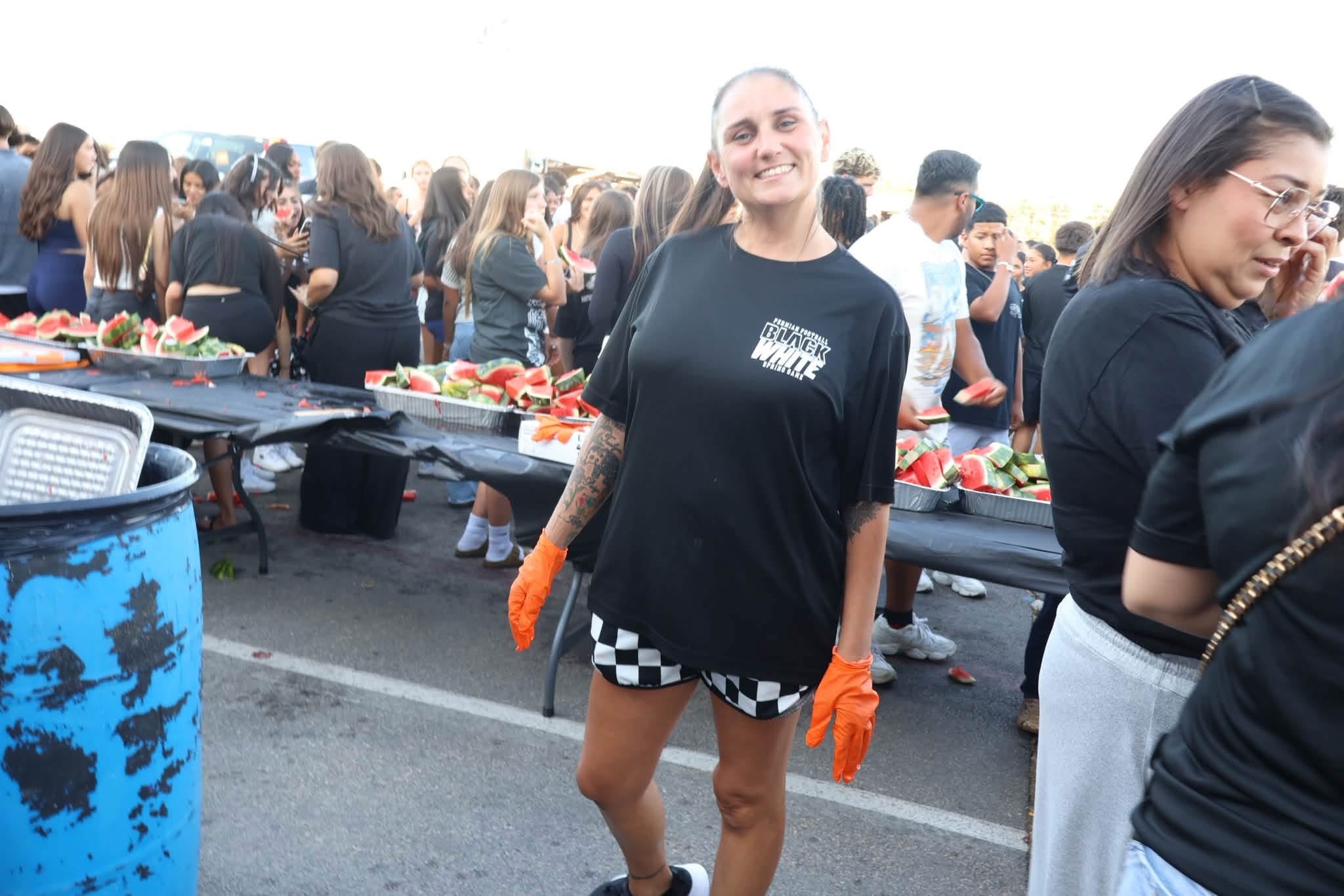 Permian Panthers Watermelon Feed volunteers serving